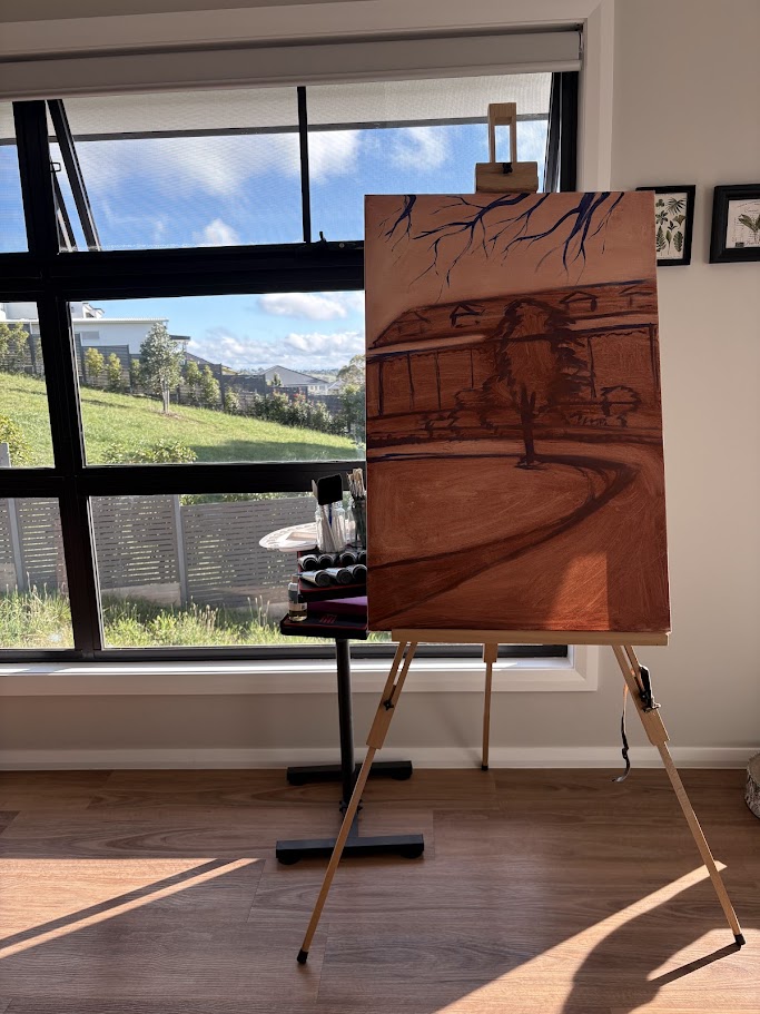 A canvas painted with a light shade of brown.