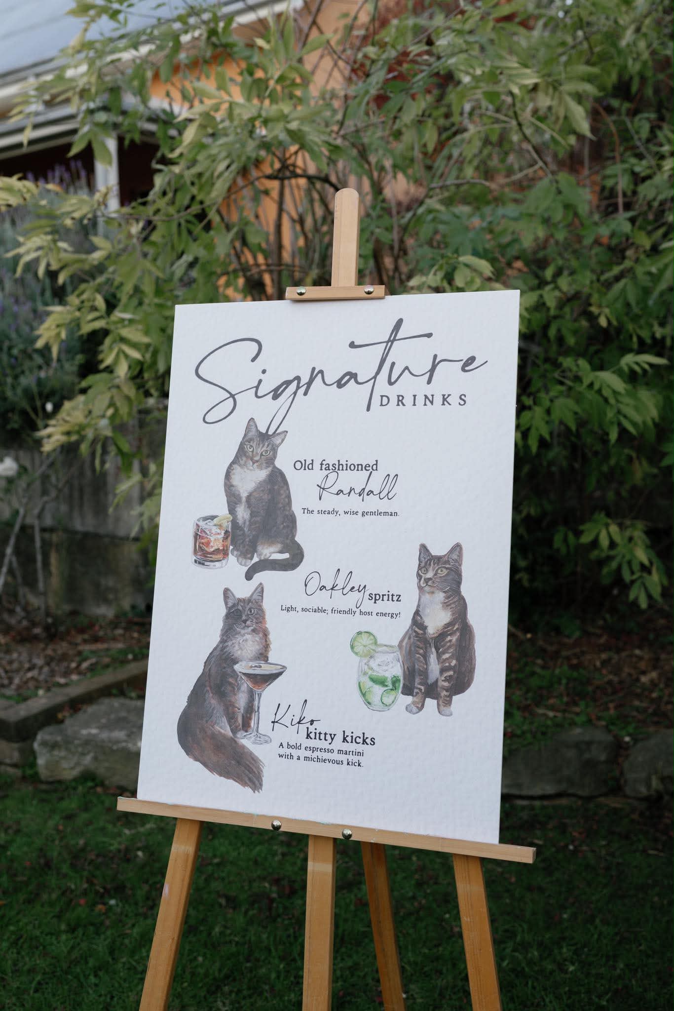 Watercolour painting of 3 tabby cats.